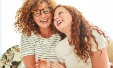 img-mother-and-daughter-lauging-on-cauch-720x530px.jpg